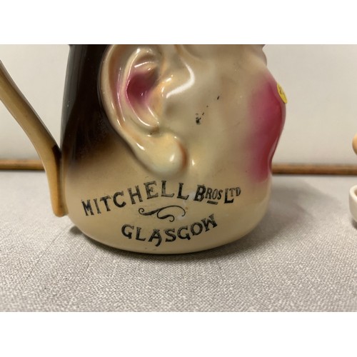 318 - Rare english staffordshire mitchell bros of glasgow whisky jug along with laurel & hardy cruet
Jug 1... 