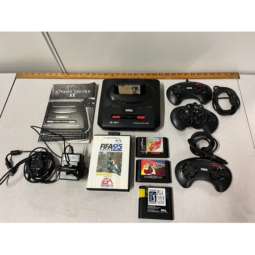 304 - Sega Mega Drive II 16-BIT system along with controllers & 5 games.