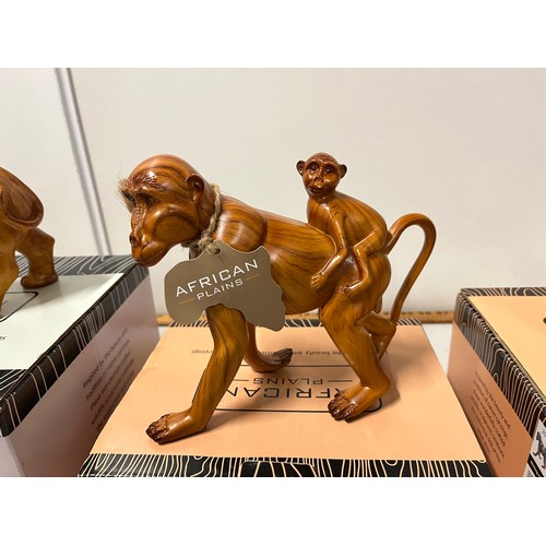 478 - 3 Boxed African Plains wooden sculptures to include Rhino, Lion & Monkey & baby.
largest 23cm