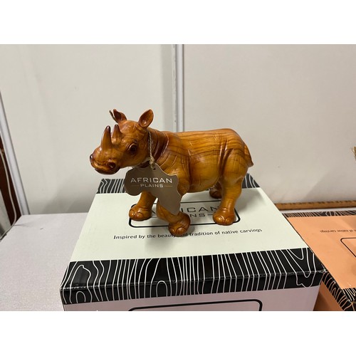 478 - 3 Boxed African Plains wooden sculptures to include Rhino, Lion & Monkey & baby.
largest 23cm