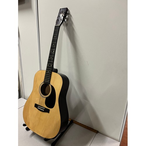 331 - An acoustic guitar.