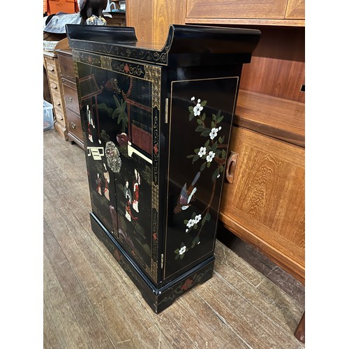 79 - Black lacquered oriental 2 door cabinet.
101cm x 70cm x 30cm