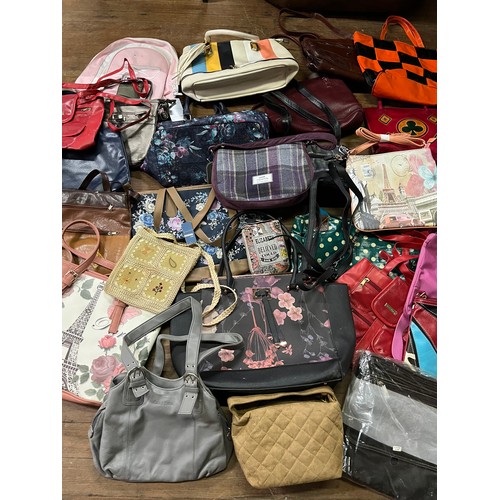 411 - Large collection of over 40 handbags to include new & used.