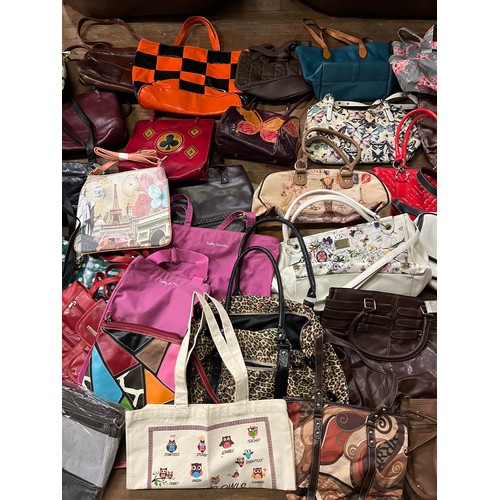 411 - Large collection of over 40 handbags to include new & used.