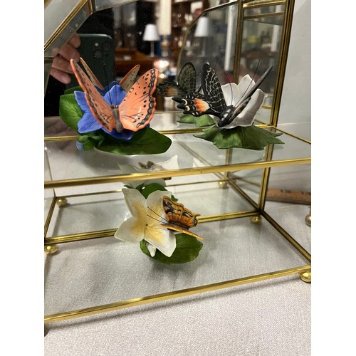 49 - collection of franklin mint ceramic butterfies along with 3 glass display cabinets