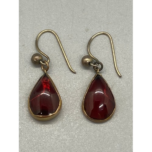 55 - Pair of gold and turquoise earrings and pair of gold and garnet earrings.