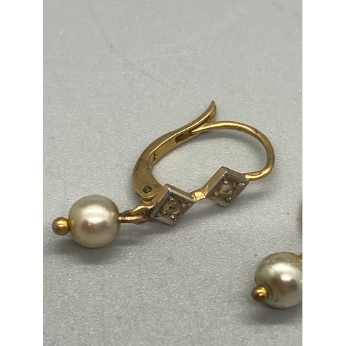 57 - Pair of gold, diamond and pearl earrings.