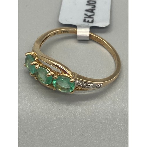 37 - 10k yellow gold, emerald and diamond ring.