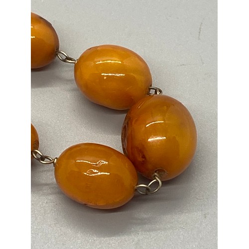 39 - Raw amber graduating necklace.
21.97g