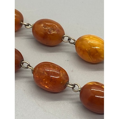 39 - Raw amber graduating necklace.
21.97g