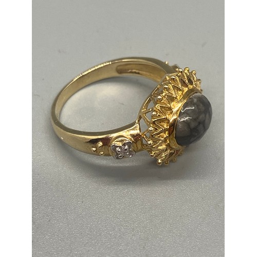 72 - 375 yellow gold & diamond gem set sunburst ring.