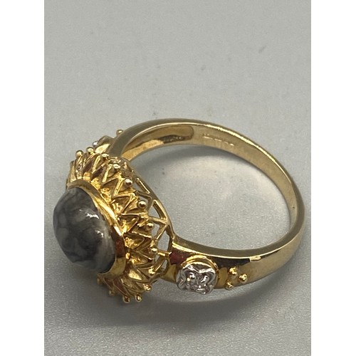 72 - 375 yellow gold & diamond gem set sunburst ring.