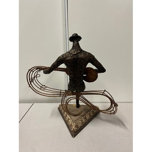 152 - large bronze style sculpture of a guitar player on wooden base 48cm tall