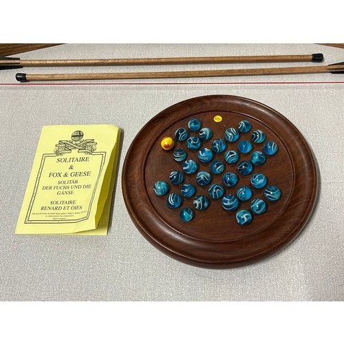 118 - Wooden marble solitaire board game along with wooden bow and arrow.