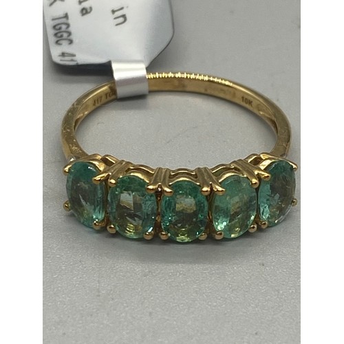 10 - 10k yellow gold, emerald and diamond 5 stone ring.