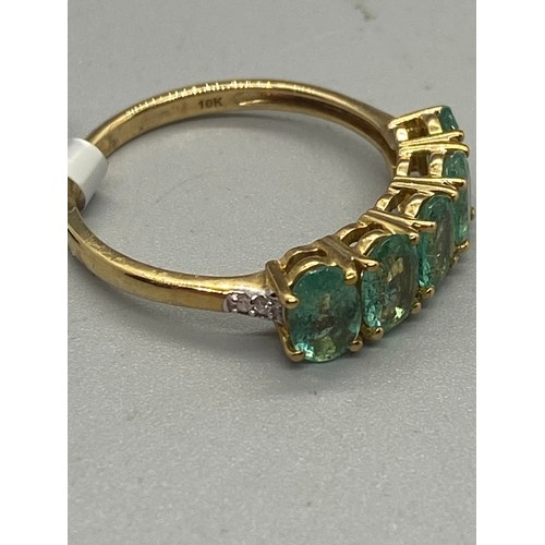 10 - 10k yellow gold, emerald and diamond 5 stone ring.