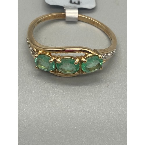 37 - 10k yellow gold, emerald and diamond ring.