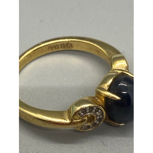 173 - Star blue sapphire, white topaz and gold plated sterling silver ring. size N To O.