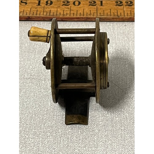 17 - Victorian brass, crank wind fishing reel with raised rear check housing 2 1/2