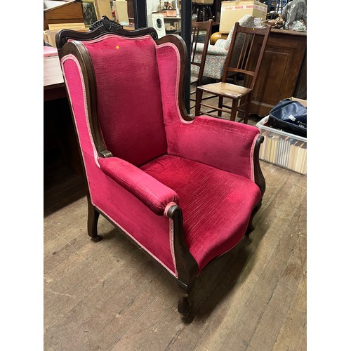 55 - Louis XIV style revival wingback armchair on cabriole legs with 4 metal castors.