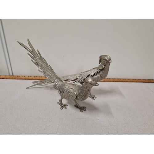 83 - Pair of heavy silver plated pheasants. 35cm long