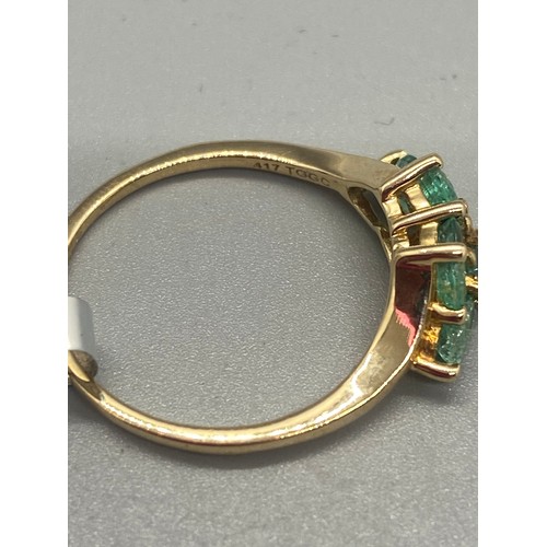 35 - 10k yellow gold and emerald 5 stone ring.