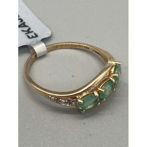 37 - 10k yellow gold, emerald and diamond ring.