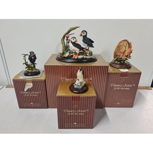 233 - 4 x boxed Country Artist ornaments - Puffins, chimpanzees, penguins and field mice.