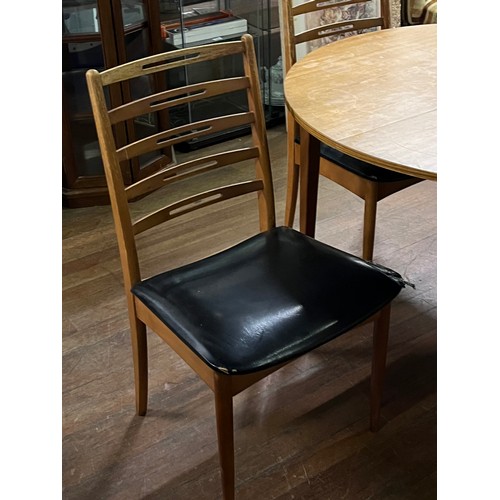 260 - Mid century round table & 4 vinyl ladderback chairs.