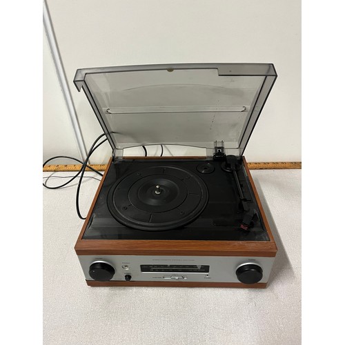 319 - Stereo integrated turntable ampli-tuner.