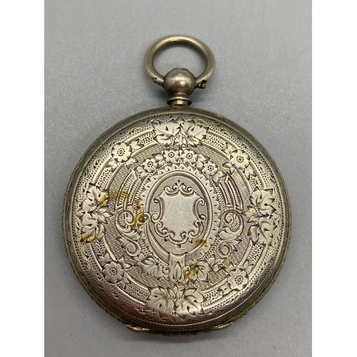 23 - Silver pocket watch case, pocket compass, Le Mans badge and rolled gold religious pendant.