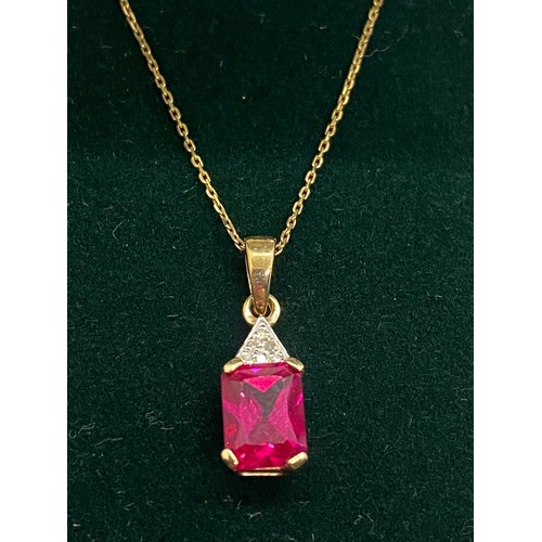 40 - 9ct gold, ruby and diamond chain, pendant and earring set.