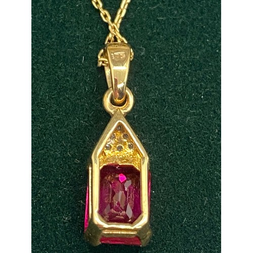 40 - 9ct gold, ruby and diamond chain, pendant and earring set.