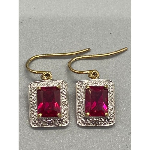 40 - 9ct gold, ruby and diamond chain, pendant and earring set.