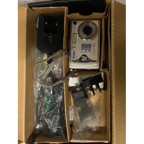 324 - 2 boxed cameras to include Vivitar digital camera & GE digital camera.