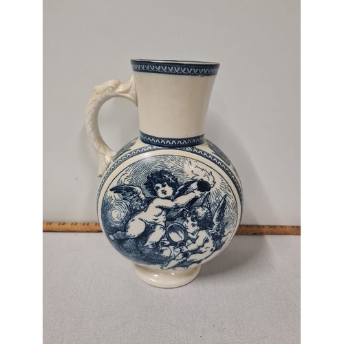 106 - Vintage Burselem vase depicting cherubs with bird handle by F.J. Emery, Urbino 34cm tall