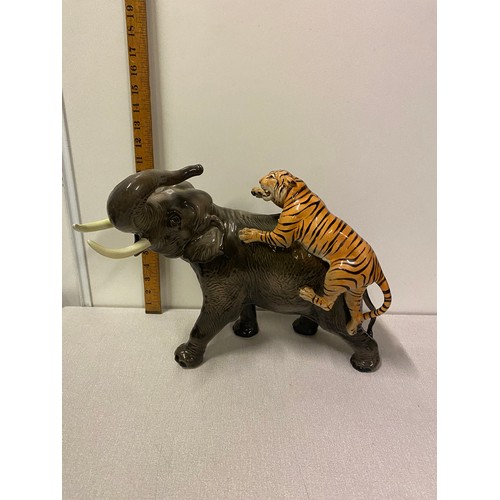 213 - Large Vintage Italian Giovanni Ronzan porcelain elephant & tiger in attack signed. 40cm long