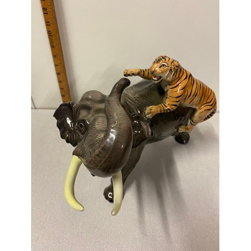 213 - Large Vintage Italian Giovanni Ronzan porcelain elephant & tiger in attack signed. 40cm long