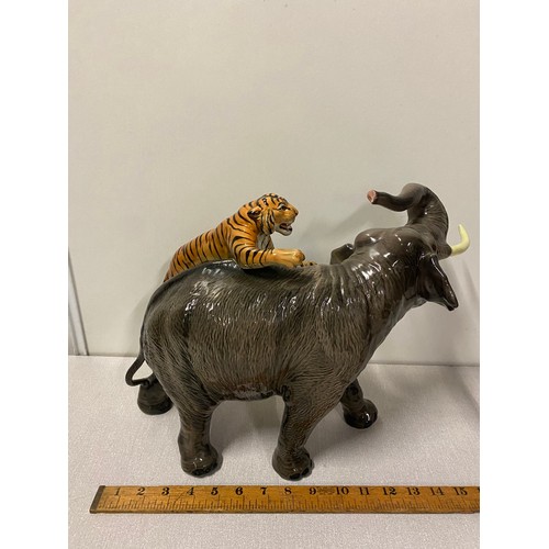 213 - Large Vintage Italian Giovanni Ronzan porcelain elephant & tiger in attack signed. 40cm long