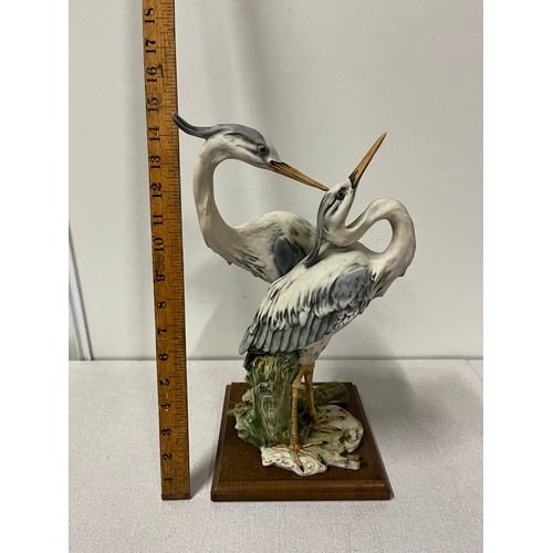 119 - Giuseppe armani grouping of 2 herons on wooden stand  signed 37cm tall