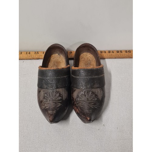 135 - A pair of antique wooden clogs