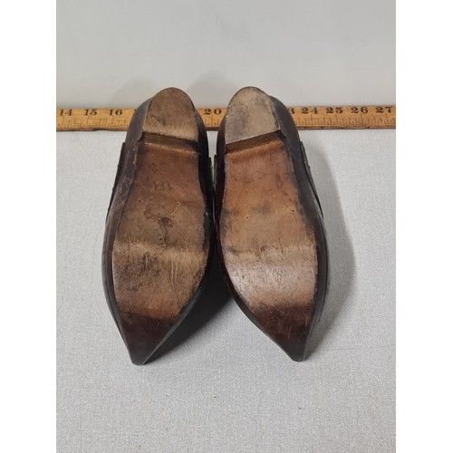 135 - A pair of antique wooden clogs