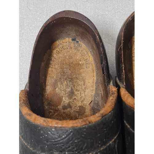 135 - A pair of antique wooden clogs