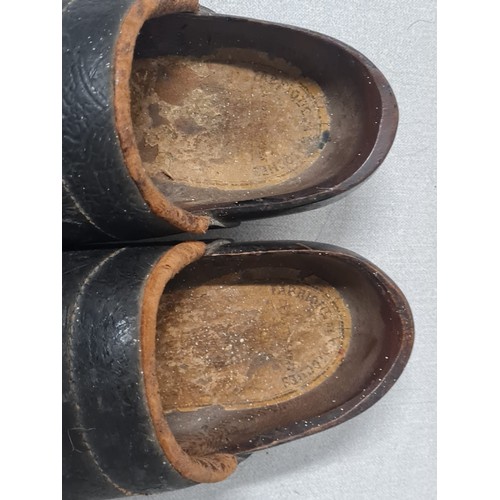 135 - A pair of antique wooden clogs