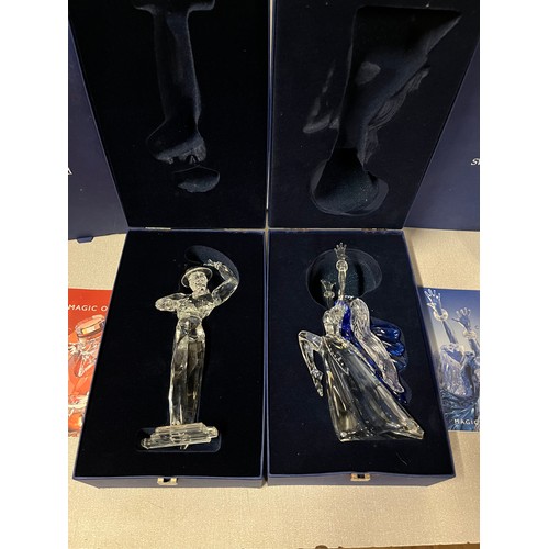 166 - 2 large boxed swarovski figurines antonio & isador with stands