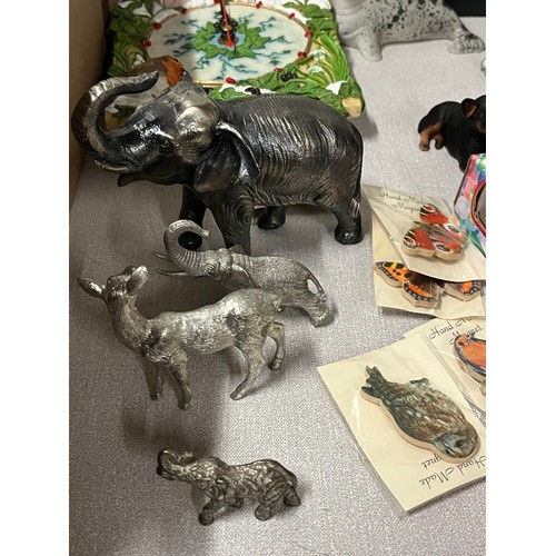 449 - large lot of collectables to include metal elephants , tins & tetley tea folk etc