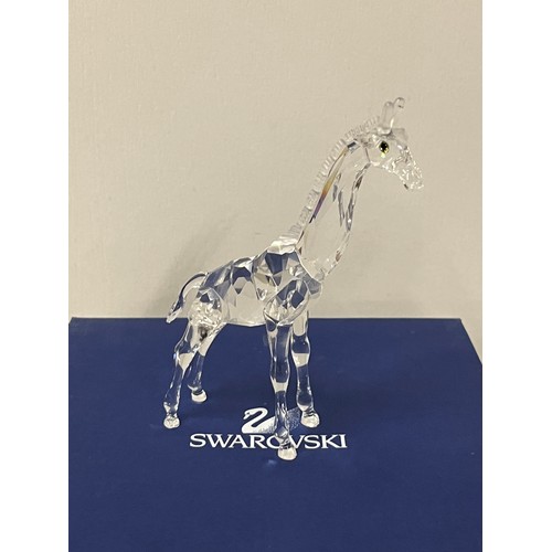 14 - Swarovski crystal baby giraffe with original box.
13.5cm h