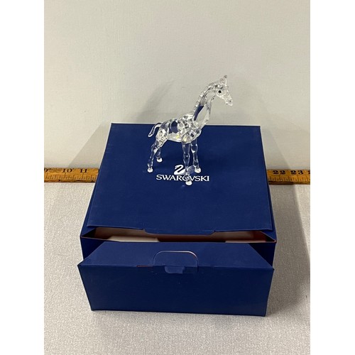 14 - Swarovski crystal baby giraffe with original box.
13.5cm h