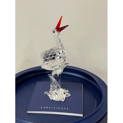 15 - Swarovski crystal stork with baby 'cheerful times' with original box.
11.5cm h