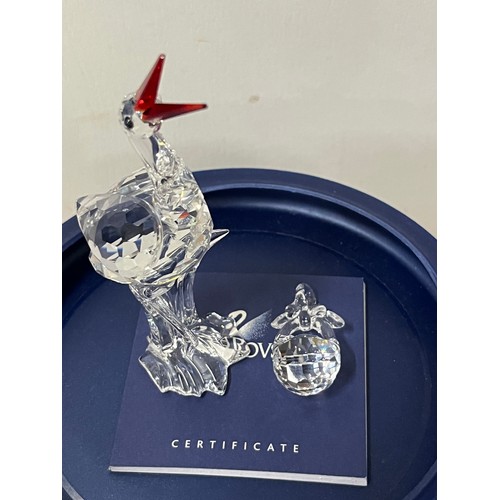 15 - Swarovski crystal stork with baby 'cheerful times' with original box.
11.5cm h